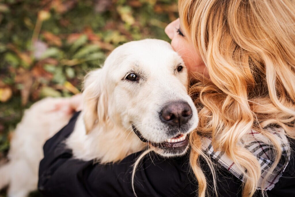 woman-hugging-golden-dog