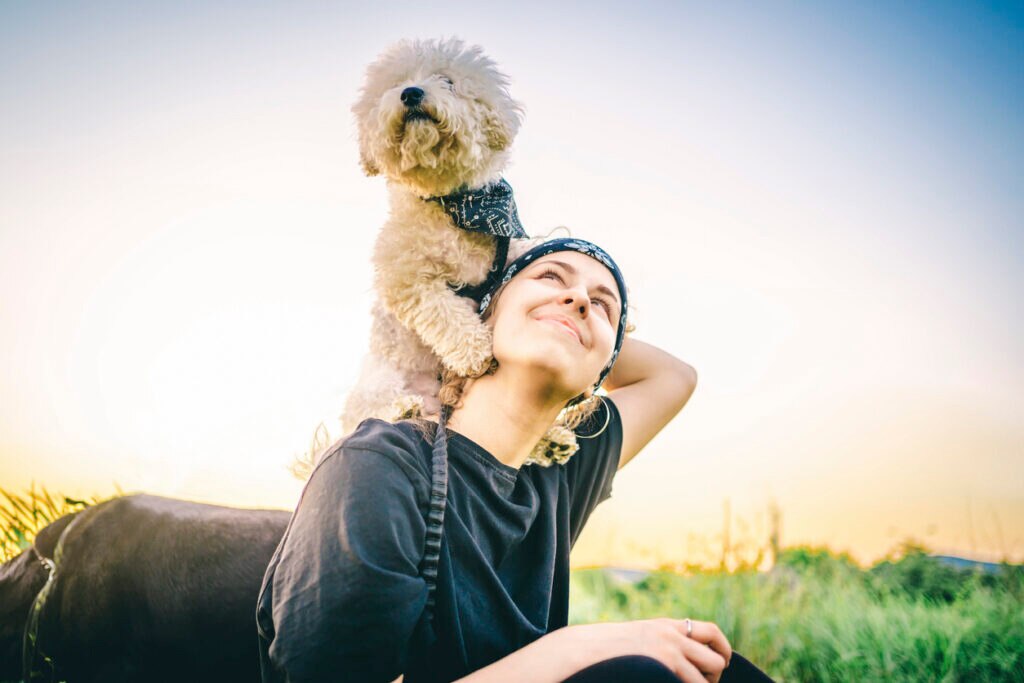 woman-holding-dog-on-shoulder