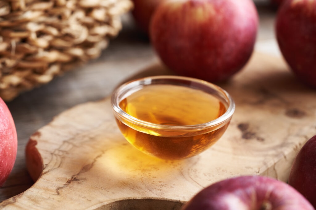 A small bowl of apple cider vinegar.