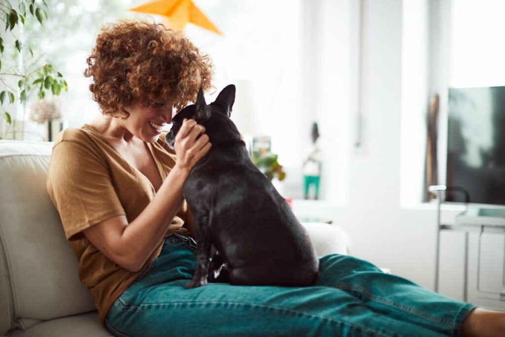 woman-sitting-with-dog-on-lap