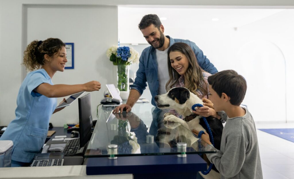 dog greeting vet tech at a veterinarian's office