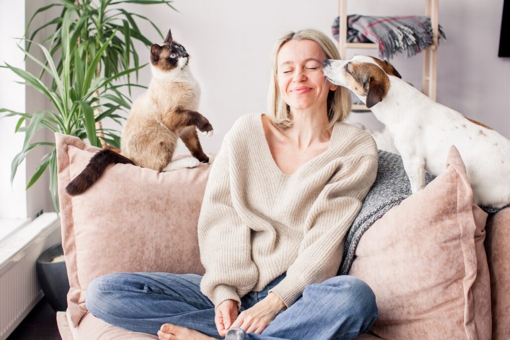 woman with dog and cat