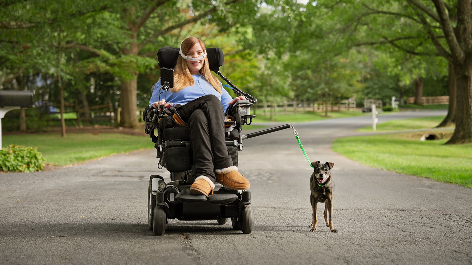 Brooke Eby and her dog Dray test out their new adaptive leash