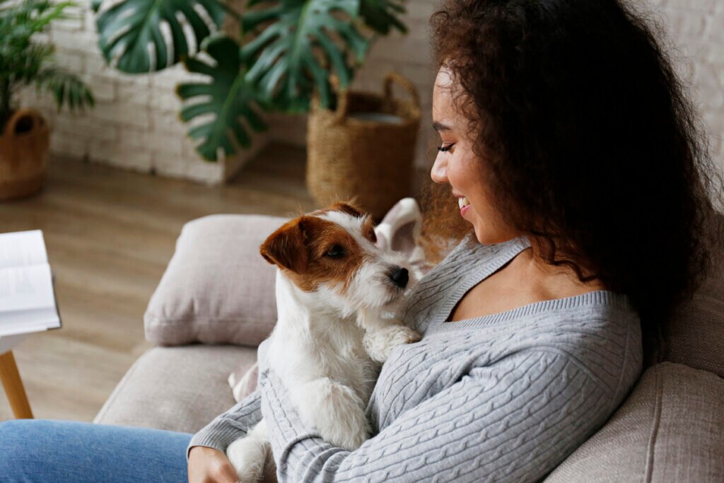 woman holding a Terrier